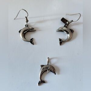 set of sterling silver dolphin dangle earrings and a matching pendant